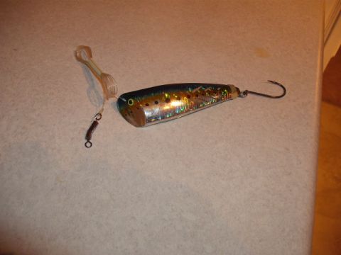 1990 Ford Bronco - A fishing lure designed to mimic a fish, holographic scales and a sharp hook for catching prey.