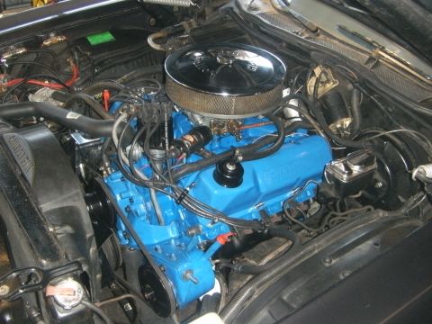 1972 Ford Ranchero - Engine bay view showing a blue V8 engine with a chrome air cleaner and visible wiring.