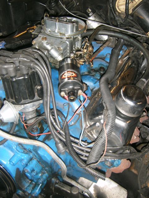 1972 Ford Ranchero - Close-up view of an engine bay, showing various components like the carburetor and distributor.