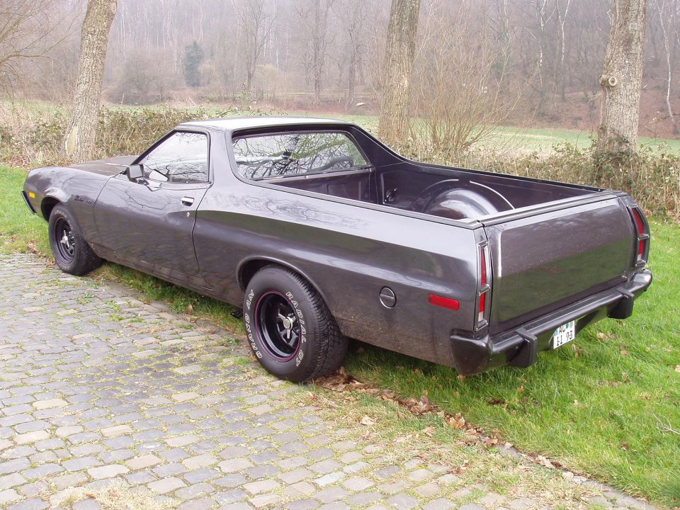 1972 Ford Ranchero parked on cobblestone driveway, rear 3/4 view