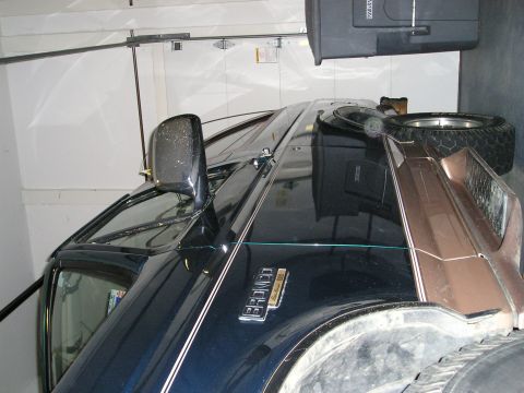1996 Ford Bronco - This 1996 Ford Bronco is shown from the front three-quarter angle inside a garage.