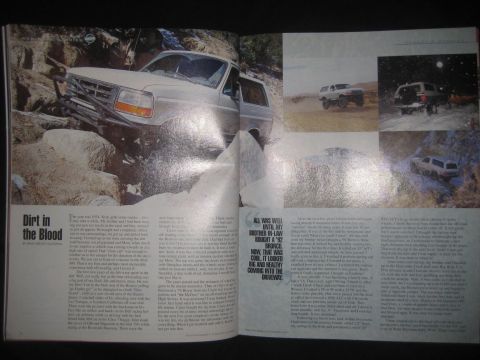 1996 Ford Bronco - This 1996 Ford Bronco is shown tackling a challenging off-road course, demonstrating its capability on rough terrain.