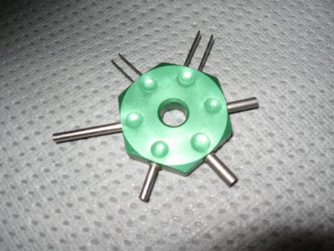 1994 Ford Bronco - A green automotive tool, likely for electrical connectors, is shown against a textured gray background.