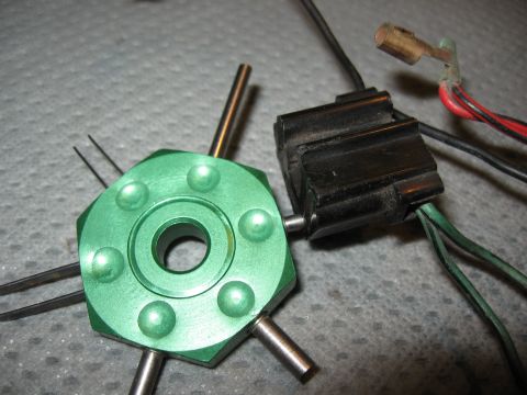 1994 Ford Bronco - Close-up of an automotive electrical connector and a specialized tool.