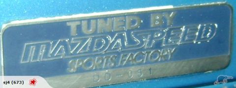 1993 Mazda MX-3 - A close-up of a Mazdaspeed Sports Factory badge, indicating custom tuning.