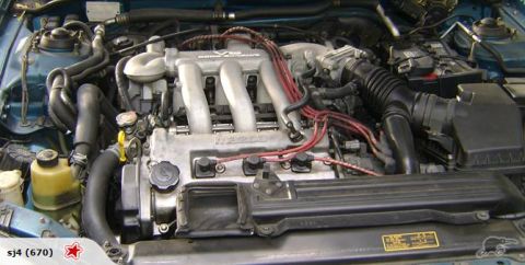 1993 Mazda MX-3 - Engine bay of a 1993 Mazda MX-3, showing the V6 engine and associated components.