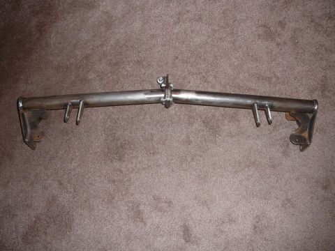 1988 Ford Bronco - This metal bar with hooks and mounting brackets is shown against a carpeted background.