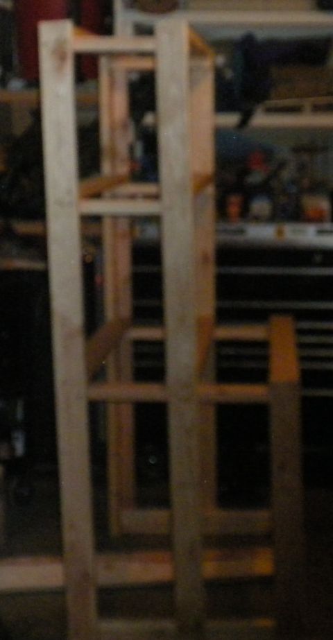 1989 Ford Bronco - A wooden shelving unit is assembled in a garage setting.