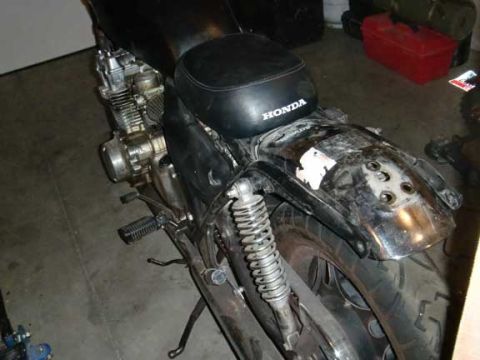 1980 Honda CB750 - A black motorcycle is shown from the rear, with its fender and seat in focus. The registry claims it is a 1980 Honda CB750.