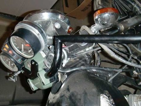 1980 Honda CB750 - Close-up of a motorcycle's instrument cluster and handlebars, showing various wires and components.