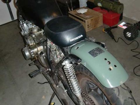 1980 Honda CB750 - Close-up of a Honda motorcycle seat, part of a larger vehicle.