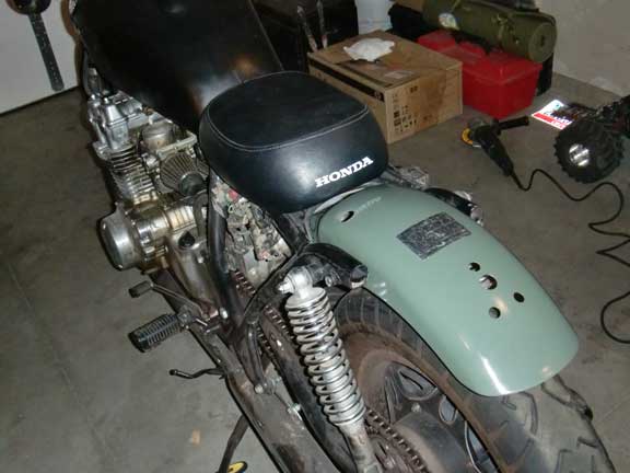 Honda motorcycle seat with "HONDA" text visible