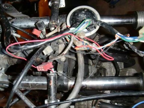 1980 Honda CB750 - Close-up of a motorcycle's complex wiring harness, showing various colored wires and connectors.