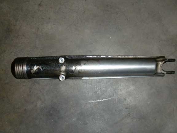 Motorcycle fork tube with two bolts on the side and threaded end