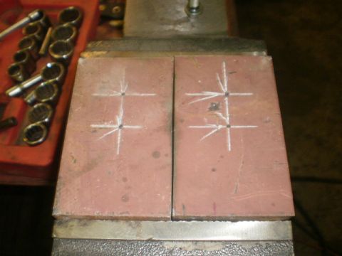 1995 Ford Bronco - Metal plates are marked for drilling while secured in a vise, with a set of sockets nearby.