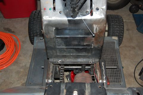 2010 Kawasaki BAYOU 220 - This image shows the rear mechanical components of a lawn tractor, not a Kawasaki motorcycle.