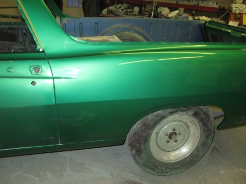 1971 Ford Ranchero - Side view of a green 1971 Ford Ranchero undergoing restoration.