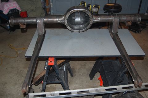 1963 Ford Galaxie - A bare metal rear axle assembly is mounted on sawhorses, ready for restoration or modification.