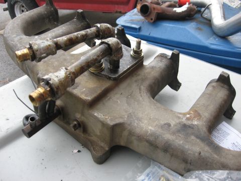 1981 Ford Bronco - Added an in and out pipe to the bottom of the intake. This allowed me to run coolant through there to warm up the intake and help the carb…