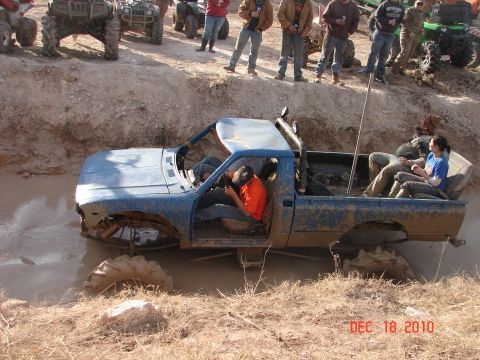 1987 Ford Bronco - Mud bogging event with a modified pickup truck and ATVs. Date stamp shows December 18, 2010.