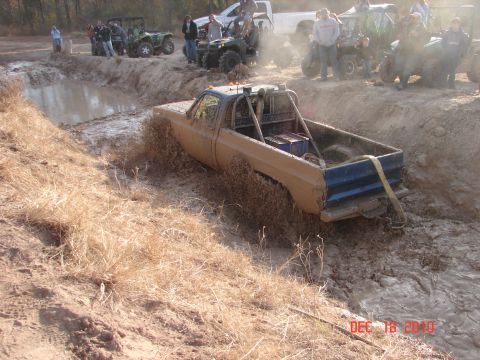 1987 Ford Bronco - Off-road vehicles participate in a mud bogging event.
