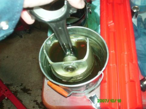 1982 Ford Bronco - Pistons getting a good soak in oil before going into the hole.