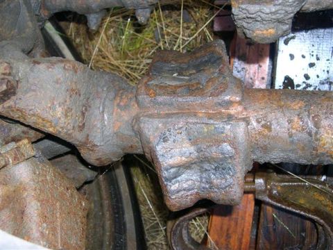 1982 Ford Bronco - This close-up shows a heavily rusted differential housing, likely from an older vehicle.