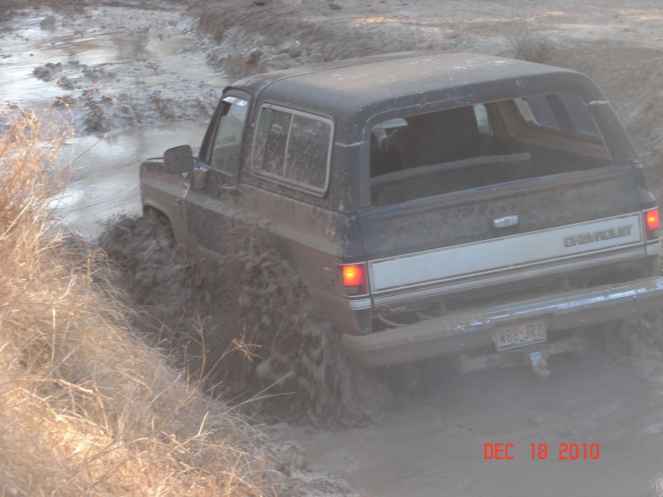 Old Chevrolet K5 Blazer driving through mud