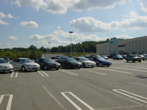 2003 Mazda 6 - Parking lot scene with multiple vehicles, including a 2003 Mazda 6.
