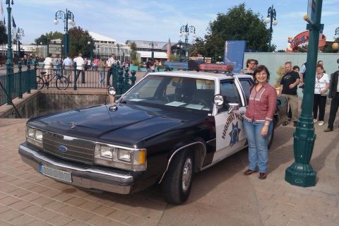1991 Ford LTD Crown Victoria - A woman stands next to a 1991 Ford Crown Victoria police car with "HIGHWAY PATROL" markings.