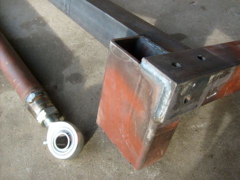 1986 Ford Bronco - Close-up of a fabricated metal suspension part, possibly for off-road use.