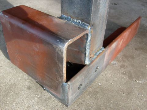 1986 Ford Bronco - Close-up of fabricated metal components, showing welds and surface rust.