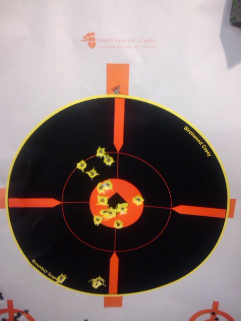 1989 Ford Bronco - A shooting target displays numerous bullet impacts clustered around the center.