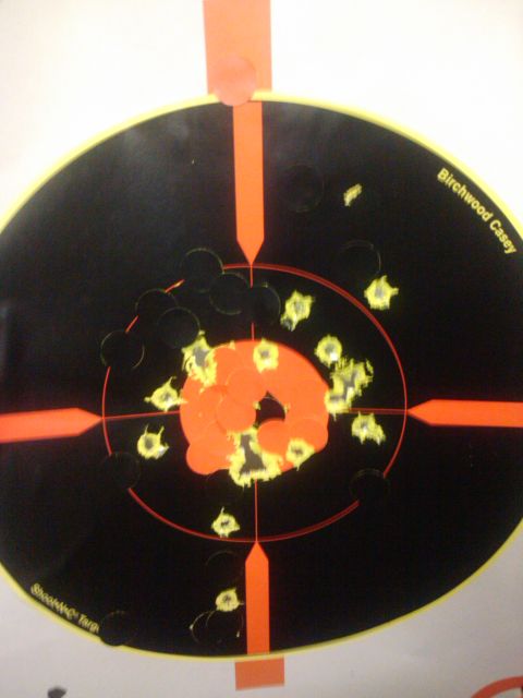 1989 Ford Bronco - A shooting target shows multiple bullet impacts around the bullseye.
