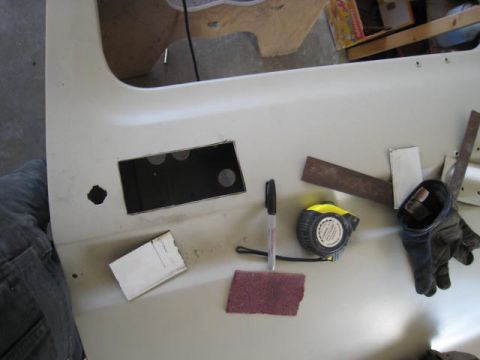 1976 Ford F-250 - Tools laid out on a vehicle door panel, possibly for modification or repair.