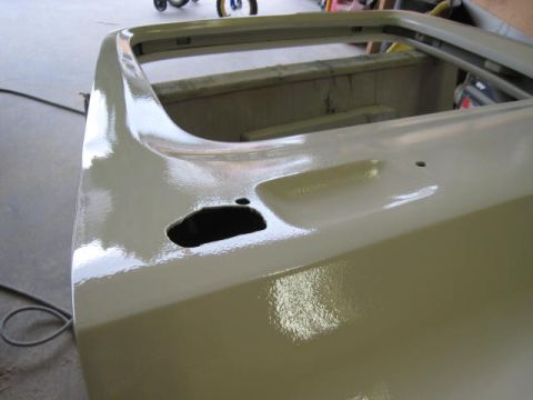 1976 Ford F-250 - The rear corner of a 1976 Ford F-250 pickup truck bed, recently primed and ready for paint.