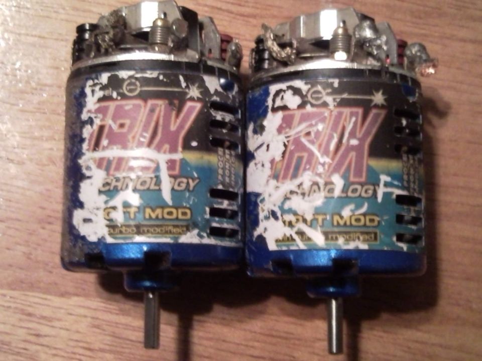 Two brushed RC car motors with 'HPI' and 'GT MOD' labels visible
