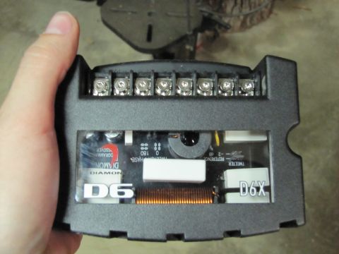 1993 Ford F-250 - Close-up of a car audio crossover component, showing internal wiring and labeling.