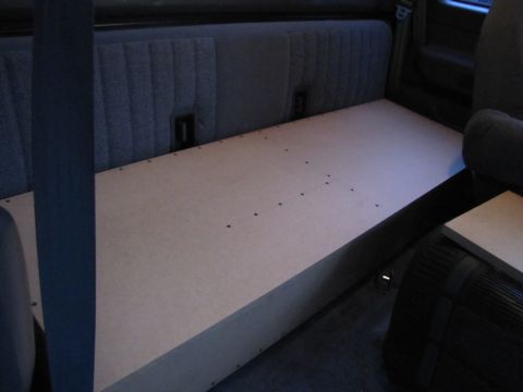 1993 Ford F-250 - A wooden platform has been installed in the rear of the truck cab, covering the seats.