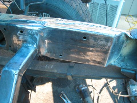 1976 Ford F-250 - The vehicle's frame is undergoing repair work, with welding and grinding evident.
