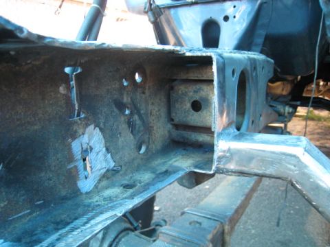 1976 Ford F-250 - This is a close-up view of a section of a truck's frame, showing some rust and recent welding work.