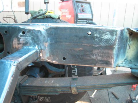 1976 Ford F-250 - Close-up of a truck's frame and suspension system, indicating repair or modification work in progress.