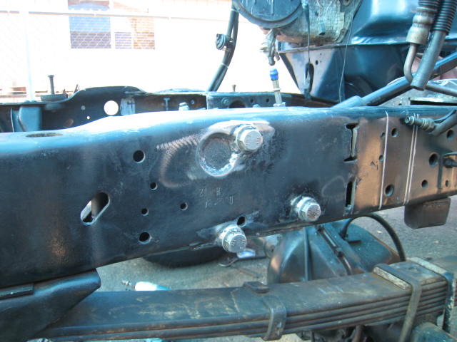 Truck frame with suspension components and bolts