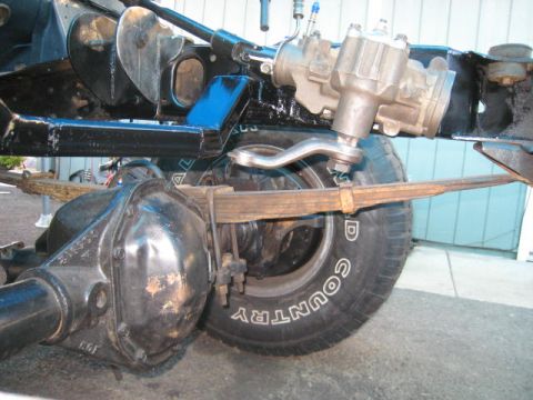 1976 Ford F-250 - Undercarriage view of a Ford truck, focusing on steering and suspension parts.