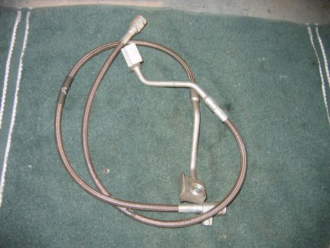 1992 Ford Bronco - Braided brake line assembly with metal tubing, likely for a vehicle.