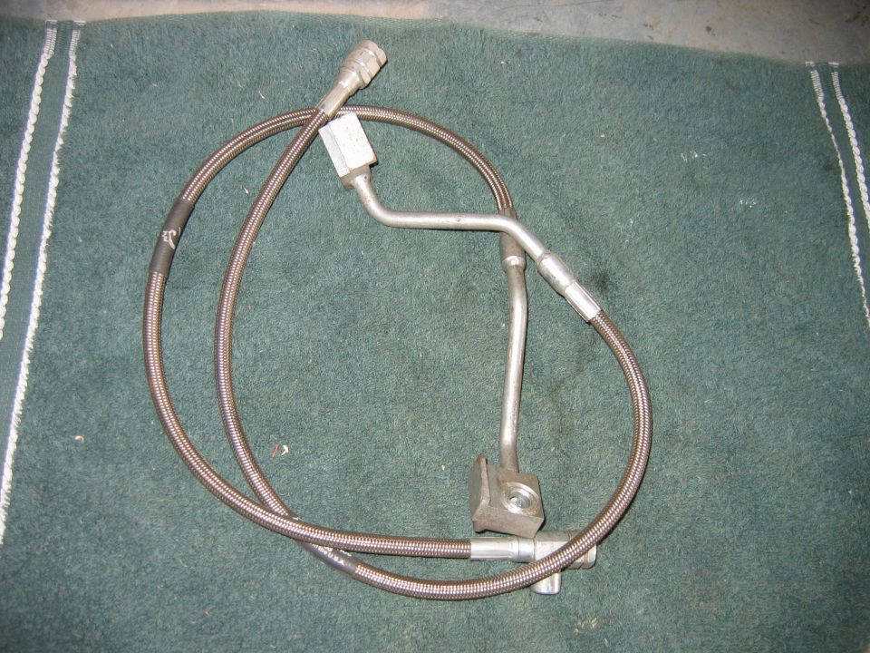 Braided brake line assembly with metal tubing