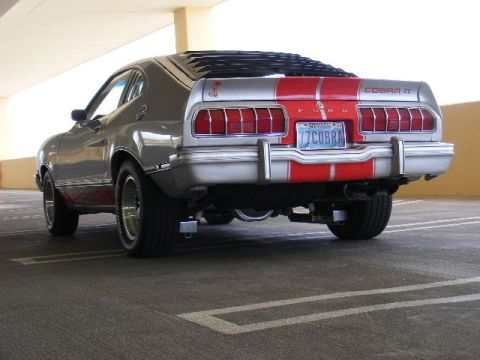 1978 Ford Mustang II - Rear view of a silver and red 1977 Ford Mustang II Cobra II with racing stripes and a Nevada license plate.