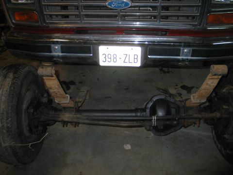 1984 Ford Bronco - Front axle and suspension components from a Ford truck, likely from the 1980s.