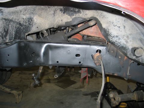 1984 Ford Bronco - Undercarriage view showing frame and suspension parts, possibly during maintenance or repair.