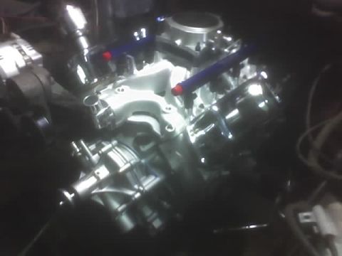 1991 Ford Bronco - Close-up view of a vehicle engine, showing the intake and fuel system components.